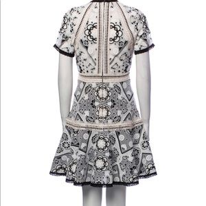 Gorgeous Alexis lace pattern mini dress. In good condition! Worn twice